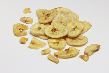 Dried Banana Chips assorted on white background © Thomas Montini