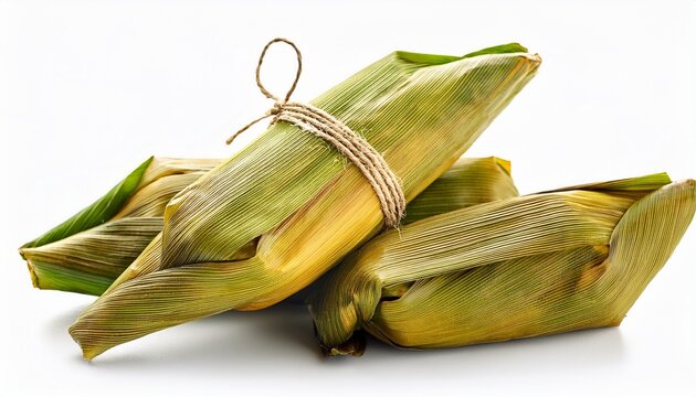 pamonha a traditional brazilian dish made from corn wrapped in its own husk white background