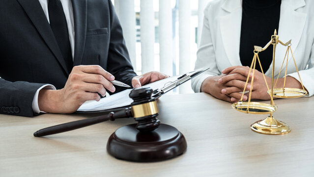 Male lawyer and Businesswoman working consulting and negotiation