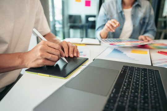 Team of creative graphic designer working on color swatch sample