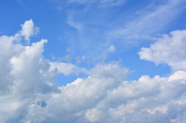 Obraz premium Blue Sky with Fluffy White Clouds, sky background, copy space