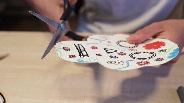 Cutting a handmade sugar skull decoration for Day of the Dead