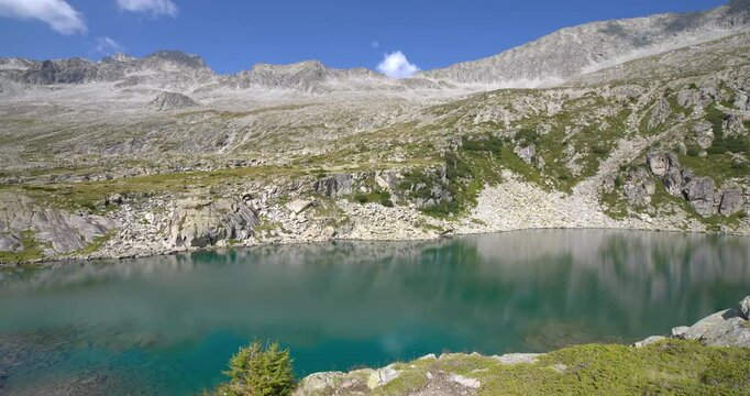  Petrol blue lake in the Dolomites of Mandrone.