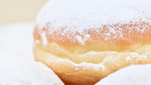 Video of Berliners (German donuts) with raspberry jam