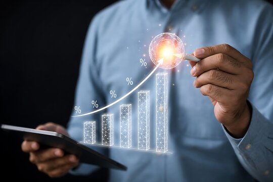 Hand pointing at upward growth graph with glowing success light on tablet