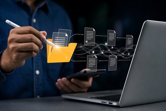 Hand holding orange juice glass near laptop displaying digital network flow and code structure