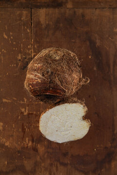 Fresh Taro Root Ion wooden table