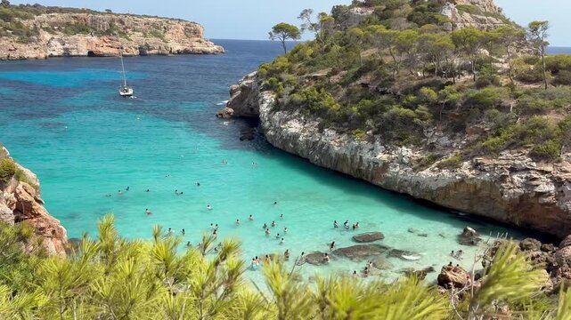 Small beautiful beach of El Moro in Mallorca at day time. Handheld