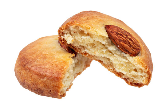 Golden baked almond cookie broken in half showing texture and nut topping isolated on a transparent background