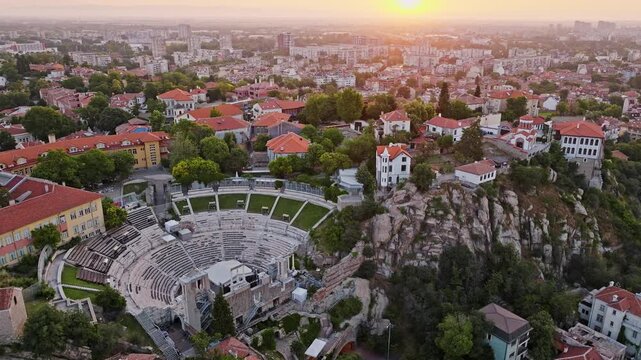 Aerial panorama of Plovdiv old town and Ancient Roman Theatre at sunrise historical city landmark travel destination in Bulgaria drone video stock