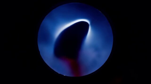 Abstract close up of blue circular light ring with gradient glow.
