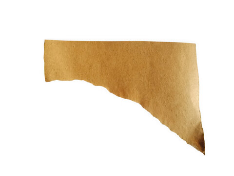 A piece of old vintage brown paper with a torn edge texture