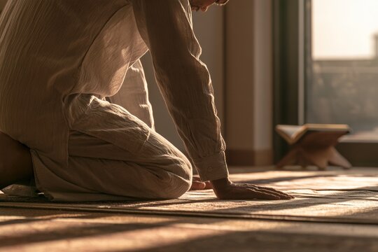 Muslim man praying at home during ramadan