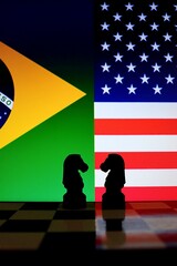 Brazil and United States flags behind chess knight pieces. Diplomatic strategy, international relations, and geopolitical negotiation.  © Blossom Stock Studio