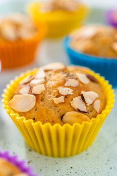 Lemon poppy seed muffins garnished with almond slivers