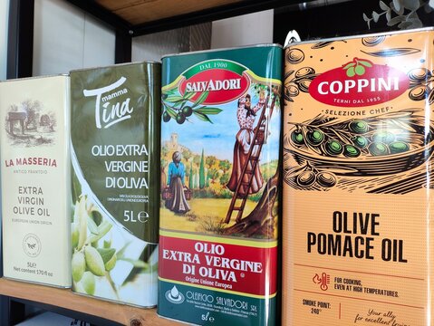 BYTOM, POLAND - APRIL 10, 2026: Big 5l Italian olive oil metal cans in a restaurant in Bytom city, Poland.