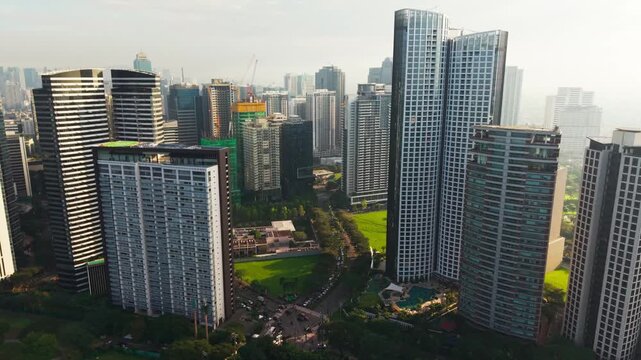 Drone glides left across Bonifacio Global City in Metro Manila, Philippines view