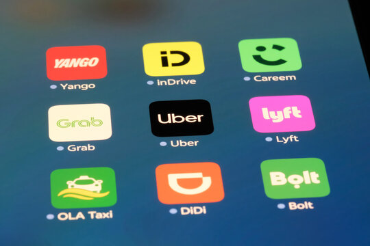 Shanghai,China-Sep.6th 2026: ride-hailing app icons on phone screen, featuring Yango, inDrive, Careem, Grab, Uber, Lyft, OLA Taxi, DiDi, and Bolt.