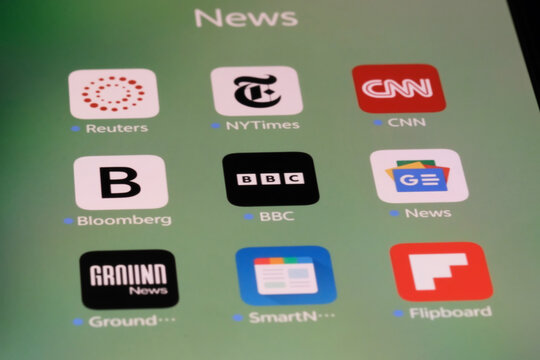 Shanghai,China-Sep.6th 2026: News and media app icons on phone screen, featuring Reuters, NYTimes, CNN, Bloomberg, BBC, Google News, Ground News, SmartNews, and Flipboard.
