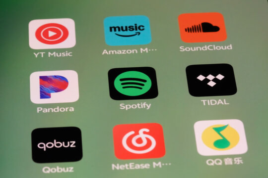 Shanghai,China-Sep.6th 2026: music streaming app icons on phone screen, featuring YouTube Music (YT Music), Amazon Music, SoundCloud, Pandora, Spotify, TIDAL, Qobuz, NetEase Cloud Music, and QQ Music