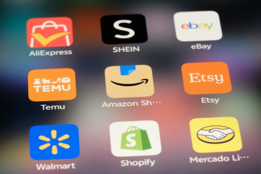 Shanghai,China-Sep.6th 2026: e-commerce shopping app icons including AliExpress, SHEIN, eBay, Temu, Amazon Shopping, Etsy, Walmart, Shopify, and Mercado Libre displayed on a smartphone screen.