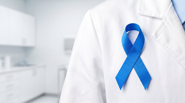 Blue ribbon on a white medical coat worn by a professional doctor as a symbol of support for diabetes awareness.
