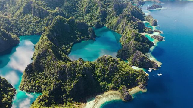 Drone turns right over turquoise lagoons in Coron Island Protected Area, Palawan