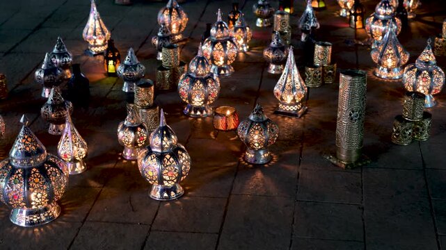 Marrakech, morocco. August 9, 2026. Traditional moroccan metal lanterns with intricate patterns glowing at night. Flickering candlelight creating a warm and festive ambiance