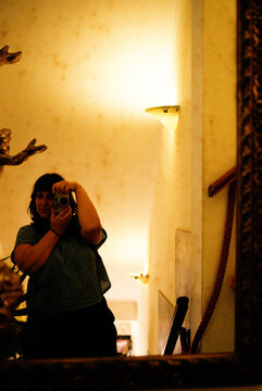 Woman taking mirror selfie