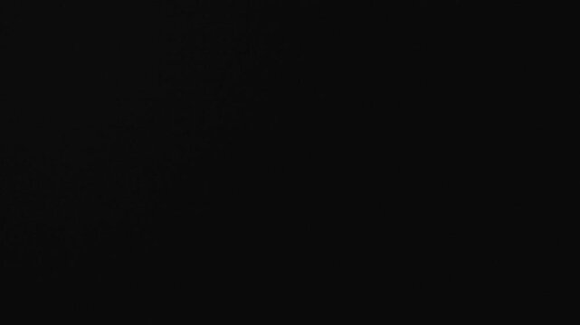 Abstract optical glass flare with soft spectral reflections and subtle light refraction over black. Ideal for adding a natural, vintage film look or artistic backdrop to video projects.