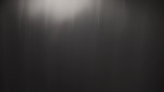 Luminous circular prism flare and subtle optical light leak isolated on black. Seamless overlay asset for cinematic film transitions, wedding videos, and ambient visual effects.