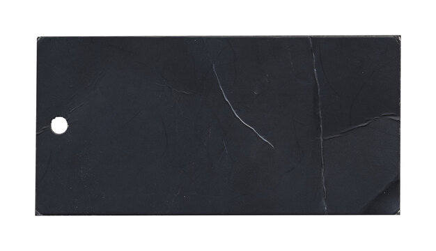 Black rectangular tag with small round hole and visible long scratches