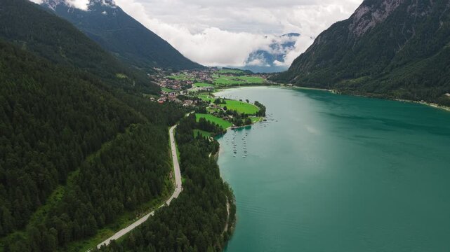 Aerial view of Achensee, the largest lake in Tyrol, Austria, showing the alpine lake surrounded by mountain landscapes and natural shoreline