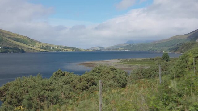 Timelapse overlooking Loch Broom towards Ullapool (Scotland) comprising dramatic scenery and light/shadow changes (artistic composition). 
