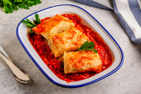 Delicious stuffed cabbage rolls served with tomato sauce