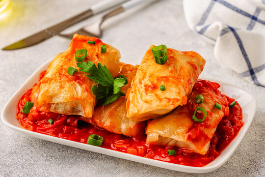 Delicious stuffed cabbage rolls served with tomato sauce