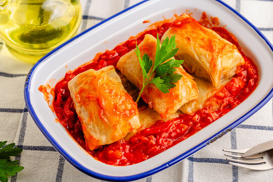 Delicious stuffed cabbage rolls served with tomato sauce