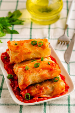 Delicious stuffed cabbage rolls served with tomato sauce