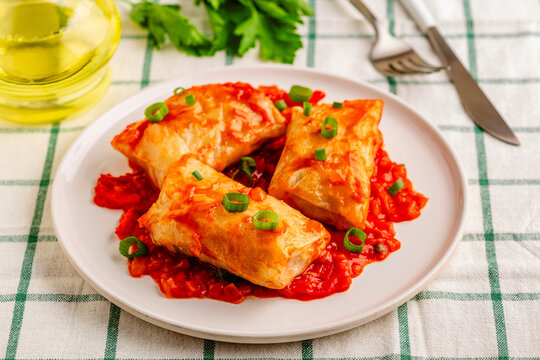Delicious stuffed cabbage rolls served with tomato sauce