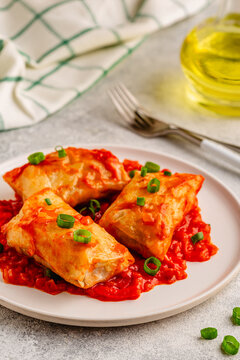 Delicious stuffed cabbage rolls served with tomato sauce