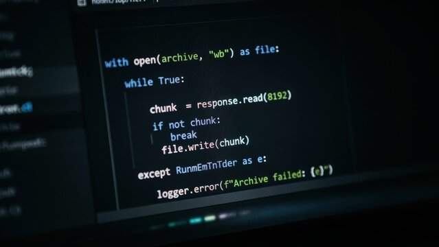 Python programming code displayed on a computer screen showing a file download script with error handling and logging functions in dark mode