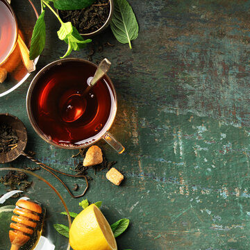 Herbal Tea with Lemon, Ginger, Mint, and Honey on Rustic Background