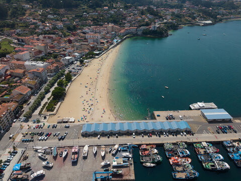 Bueu town, beach and fishing port aerial view