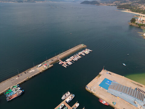 Bueu harbor aerial view with boats and aquaculture