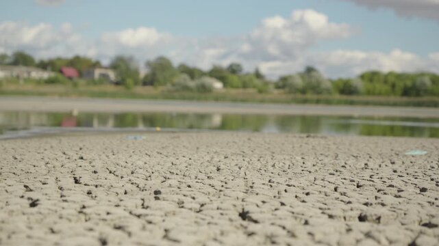 Dolly shot. Lake Bed Dries Up and Cracks During an Extreme Drought	
