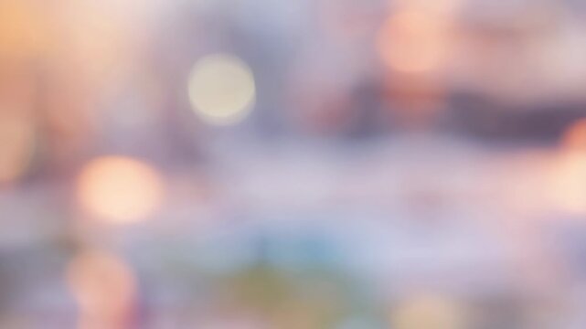 Soft pastel light circles drift through a defocused abstract bokeh background. Event invitations, social media graphics, and website headers.