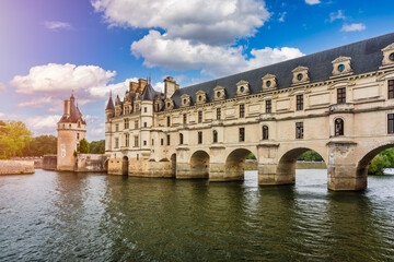 Fototapeta premium Château de Chenonceau, located in the Indre‑et‑Loire department of the Centre‑Val de Loire region in France, is a Renaissance riverside castle spanning the Cher River and known for its arches.