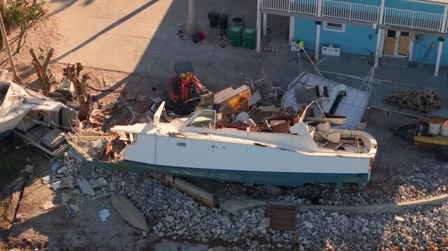 Damaged yachts after hurricane Milton on Manasota Key in Englewood, Florida. Natural disaster aftermath.