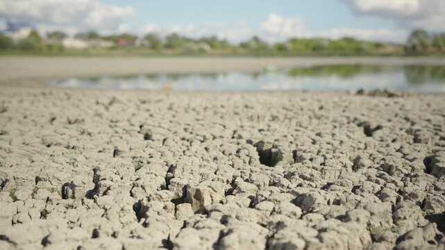 Dolly shot. Lake Bed Dries Up and Cracks During an Extreme Drought	
