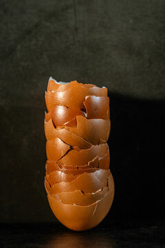 Stack of broken brown egg shells 